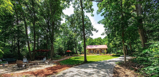 799 Millville Oxford Rd, Hamilton, OH 45013 - view of community featuring a yard, an outdoor fire pit, and a view of trees