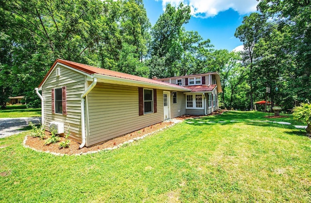 799 Millville Oxford Rd, Hamilton, OH 45013 - back of property featuring a metal roof and a lawn