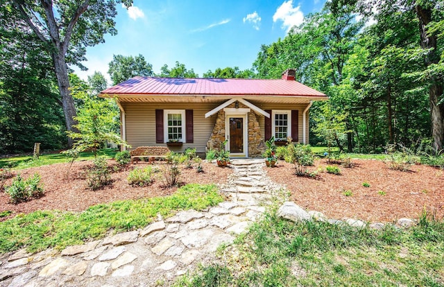 799 Millville Oxford Rd, Hamilton, OH 45013 - view of front facade with a metal roof, a porch, a chimney, and stone siding