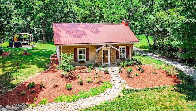 799 Millville Oxford Rd, Hamilton, OH 45013 - view of front of property with a metal roof, a front yard, a chimney, stone siding, and a porch
