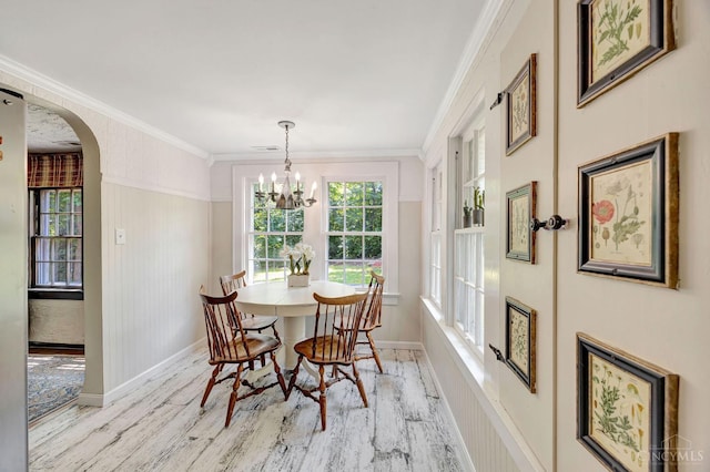 799 Millville Oxford Rd, Hamilton, OH 45013 - dining space with wood finished floors, plenty of natural light, arched walkways, crown molding, and a chandelier