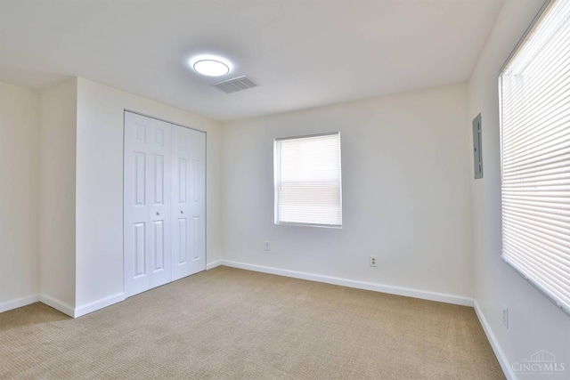 841 Willow Ave, Hamilton, OH 45013 - unfurnished bedroom featuring light carpet, a closet, and electric panel