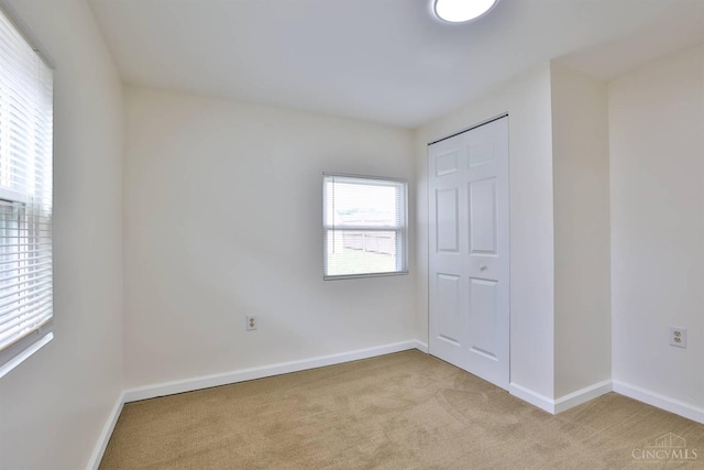 841 Willow Ave, Hamilton, OH 45013 - unfurnished bedroom with light colored carpet and a closet