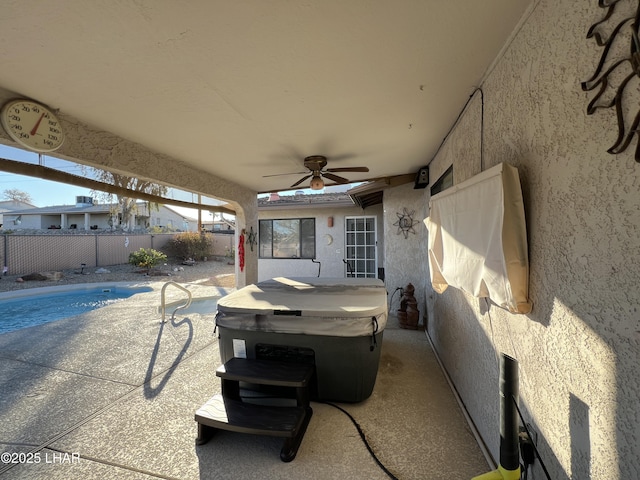 view of patio / terrace with fence and a ceiling fan