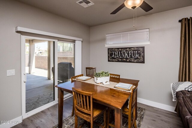 dining area featuring ceiling fan and wood-type flooring