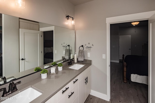 bathroom with vanity and hardwood / wood-style floors