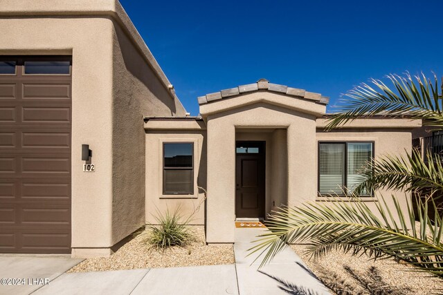 property entrance with a garage