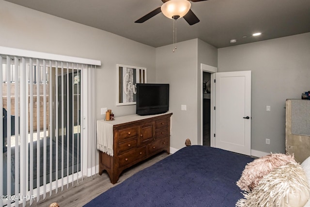 bedroom with access to exterior, ceiling fan, and light wood-type flooring