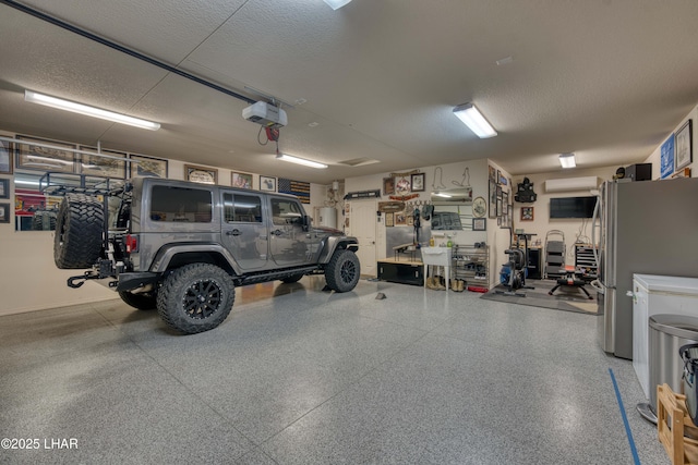 1430 Murphy Dr, Lake Havasu City, AZ 86404 - garage with a garage door opener and freestanding refrigerator
