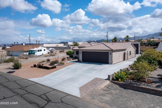 1430 Murphy Dr, Lake Havasu City, AZ 86404 - single story home featuring concrete driveway, a garage, a tiled roof, stucco siding, and fence