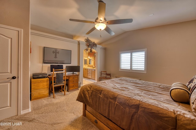 1430 Murphy Dr, Lake Havasu City, AZ 86404 - bedroom with light colored carpet, vaulted ceiling, arched walkways, a ceiling fan, and connected bathroom