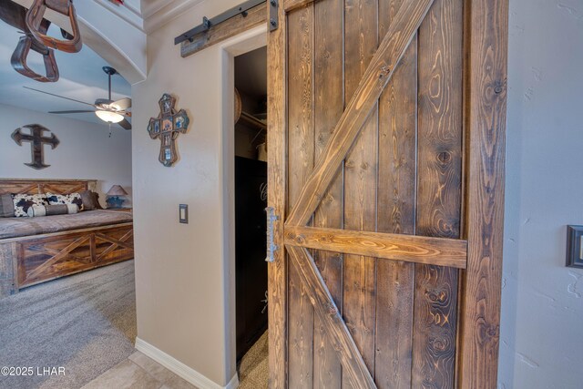 1430 Murphy Dr, Lake Havasu City, AZ 86404 - detailed view of a barn door, carpet flooring, and a ceiling fan