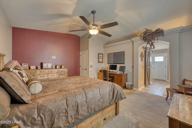 1430 Murphy Dr, Lake Havasu City, AZ 86404 - carpeted bedroom with arched walkways, vaulted ceiling, a ceiling fan, and baseboards