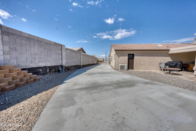 1430 Murphy Dr, Lake Havasu City, AZ 86404 - view of property exterior featuring fence, a patio area, a tiled roof, and stucco siding