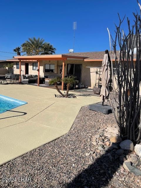 rear view of house with a patio area