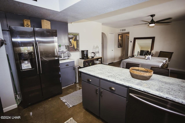 kitchen featuring ceiling fan, dishwashing machine, a textured ceiling, and stainless steel fridge with ice dispenser