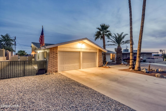 single story home featuring a garage