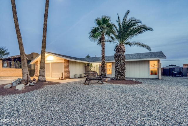 ranch-style home featuring a garage