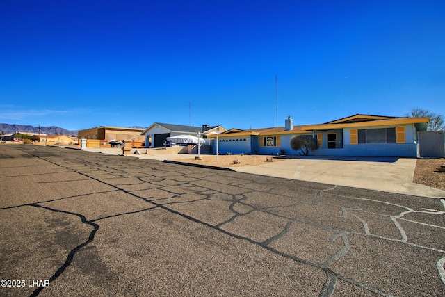 view of front of property with driveway and an attached garage