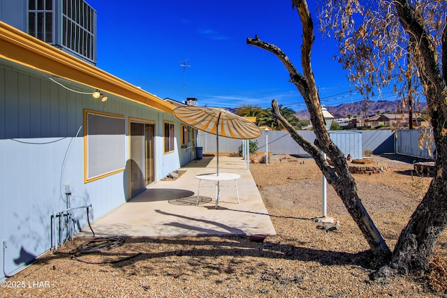 view of yard featuring a patio area and a fenced backyard