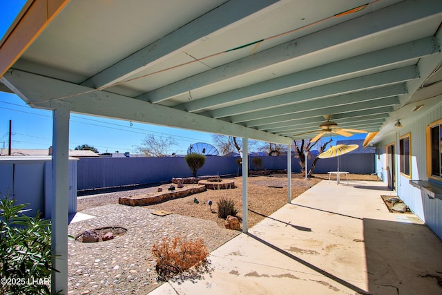 view of patio featuring a ceiling fan and a fenced backyard