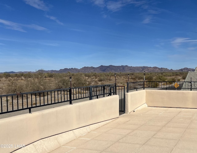 view of patio / terrace with a mountain view