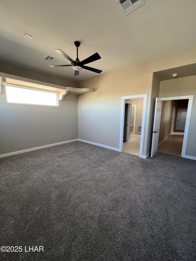 unfurnished bedroom featuring carpet floors, baseboards, and visible vents