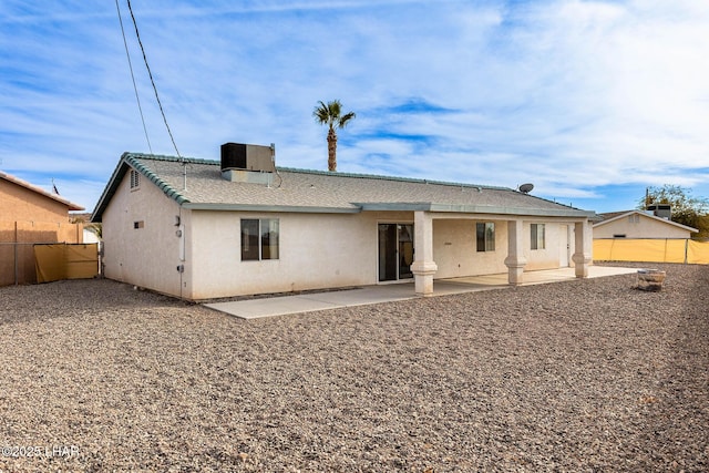 rear view of house featuring central AC and a patio area