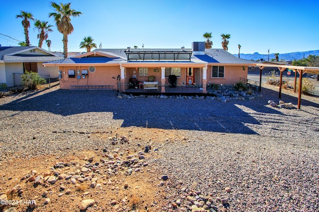 back of property featuring a deck