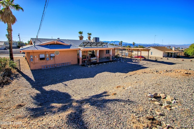 exterior space featuring central AC unit and a mountain view