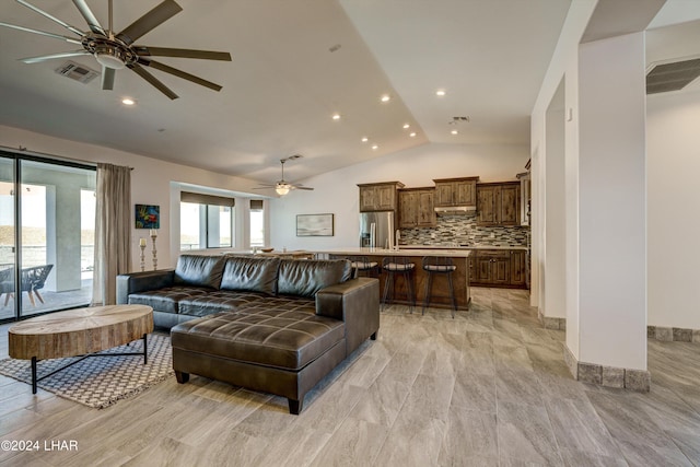 living room featuring lofted ceiling and ceiling fan