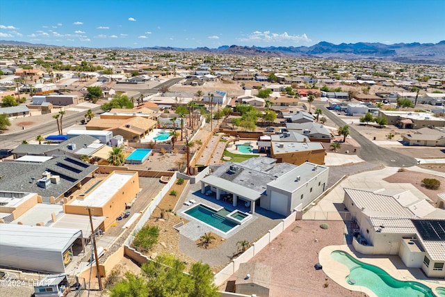 birds eye view of property featuring a mountain view