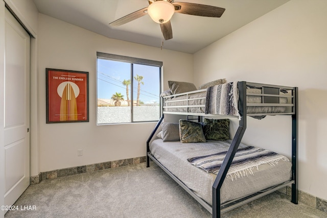 bedroom with ceiling fan and carpet flooring