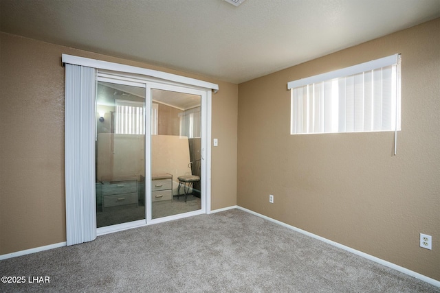 unfurnished bedroom featuring light colored carpet