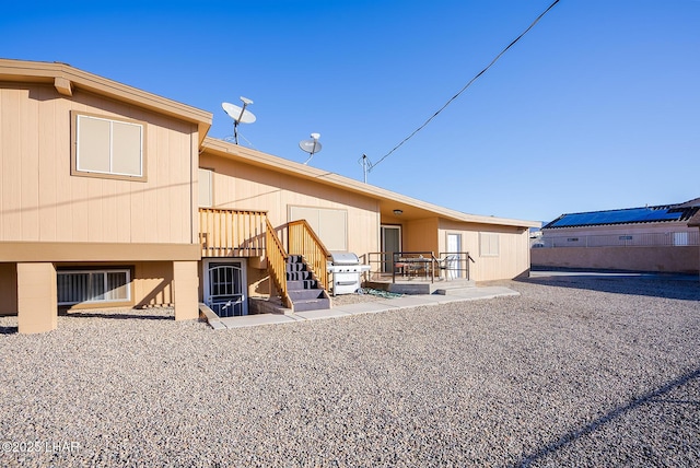 rear view of property featuring a patio