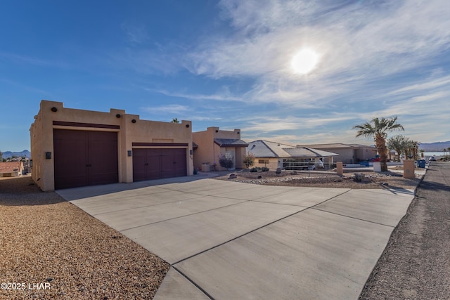 pueblo-style home featuring a mountain view