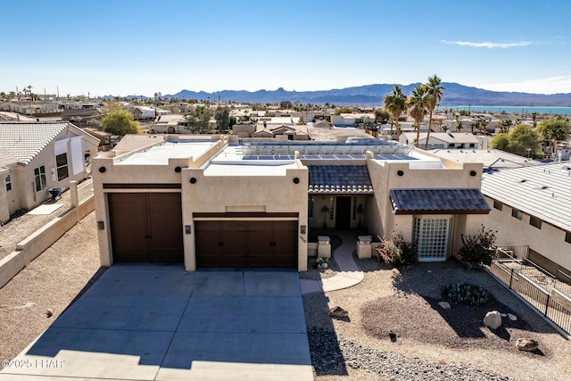 pueblo revival-style home featuring a mountain view