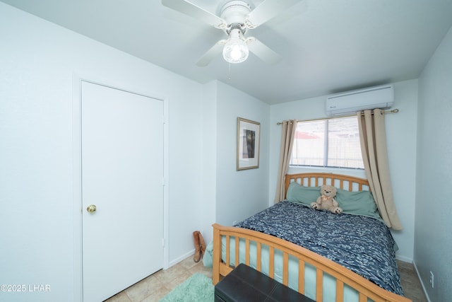 37339 Buckskin Cir, Parker, AZ 85344 - bedroom featuring a wall mounted air conditioner, baseboards, and ceiling fan