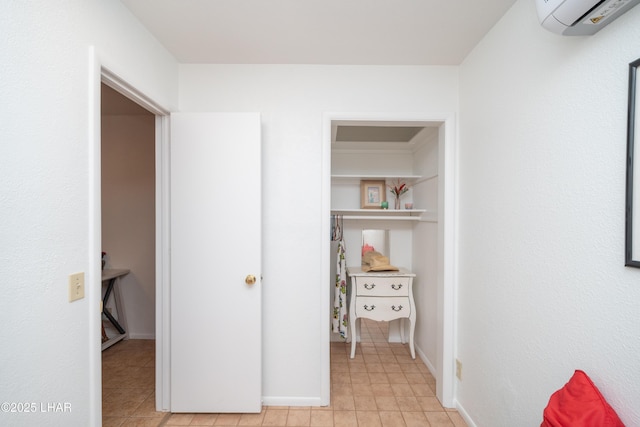 37339 Buckskin Cir, Parker, AZ 85344 - bedroom with an AC wall unit, light tile patterned flooring, and baseboards