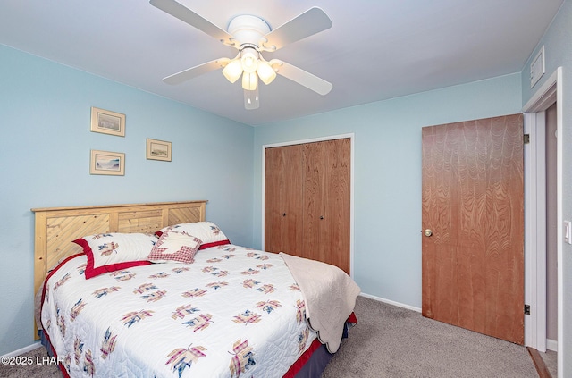 carpeted bedroom featuring ceiling fan, visible vents, and baseboards