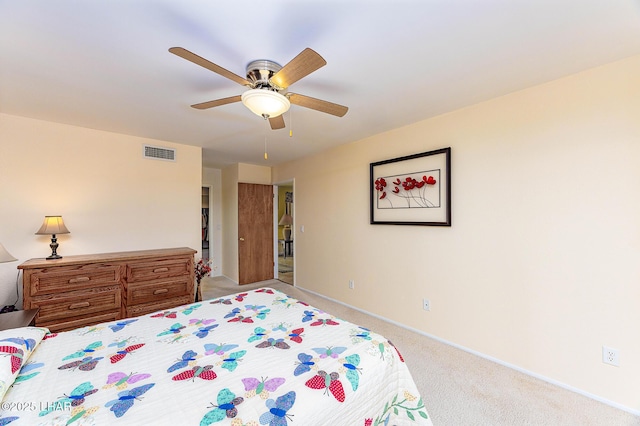 carpeted bedroom with baseboards, visible vents, and ceiling fan