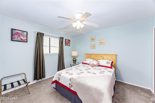 carpeted bedroom featuring ceiling fan and baseboards