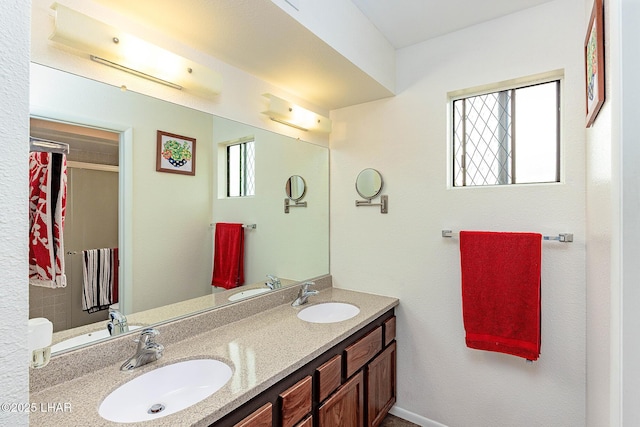 bathroom featuring double vanity and a sink