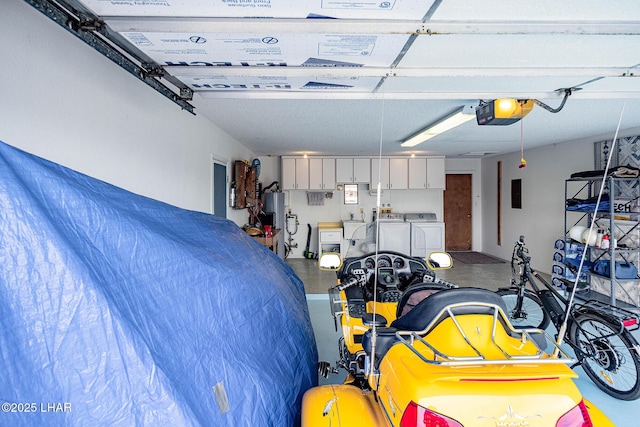 garage featuring washer and dryer and gas water heater