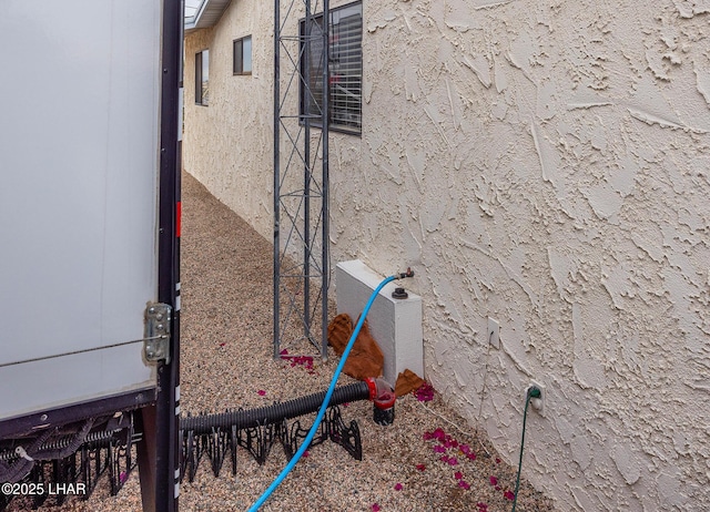 exterior details featuring stucco siding