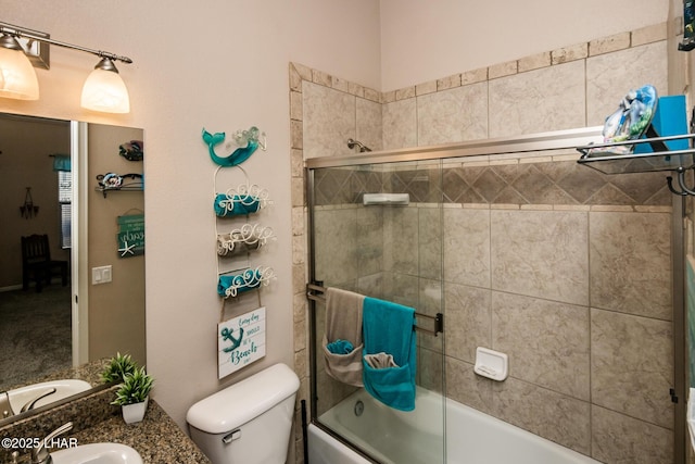 full bathroom with combined bath / shower with glass door, a sink, and toilet