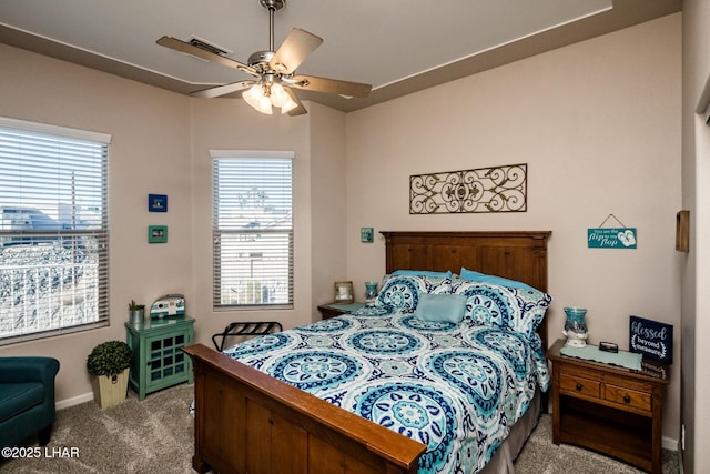 bedroom featuring a ceiling fan, carpet, and baseboards