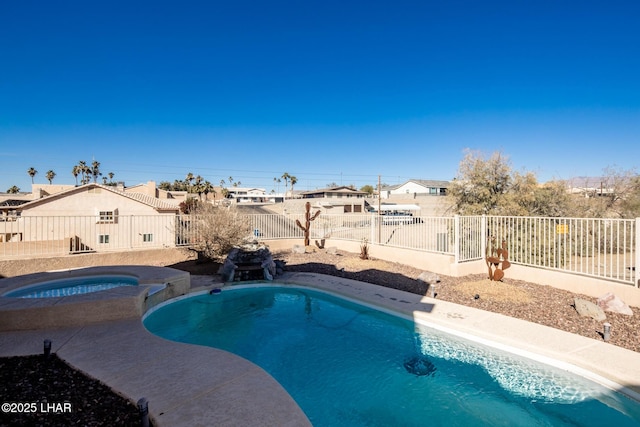 view of swimming pool featuring an in ground hot tub, a residential view, a fenced backyard, and a fenced in pool