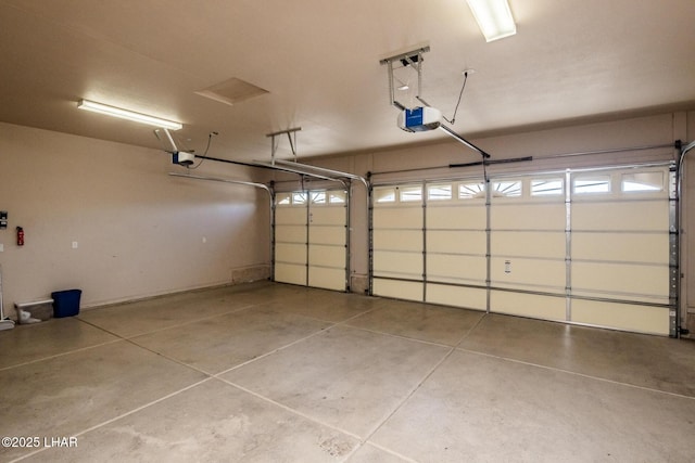 garage featuring a garage door opener