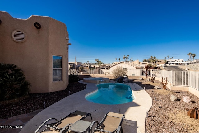 view of swimming pool featuring a fenced backyard, an in ground hot tub, a residential view, a fenced in pool, and a patio area